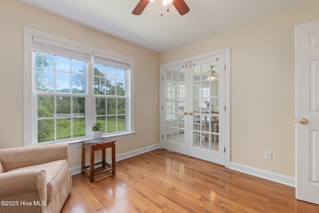 232 E Ivybridge Dr, Hubert, NC 28539 - sitting room with ceiling fan, light wood-style floors, baseboards, and plenty of natural light