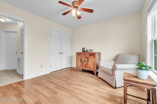 232 E Ivybridge Dr, Hubert, NC 28539 - sitting room with ceiling fan, light wood-style flooring, and baseboards