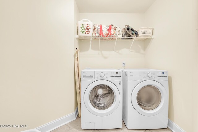 232 E Ivybridge Dr, Hubert, NC 28539 - laundry area with washer and dryer, baseboards, and light tile patterned floors