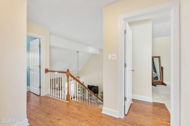 232 E Ivybridge Dr, Hubert, NC 28539 - hallway featuring an upstairs landing, wood finished floors, baseboards, and lofted ceiling