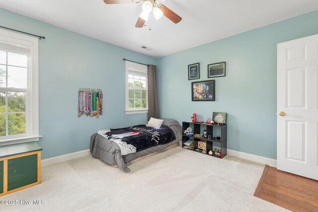 232 E Ivybridge Dr, Hubert, NC 28539 - bedroom featuring carpet floors, baseboards, and a ceiling fan