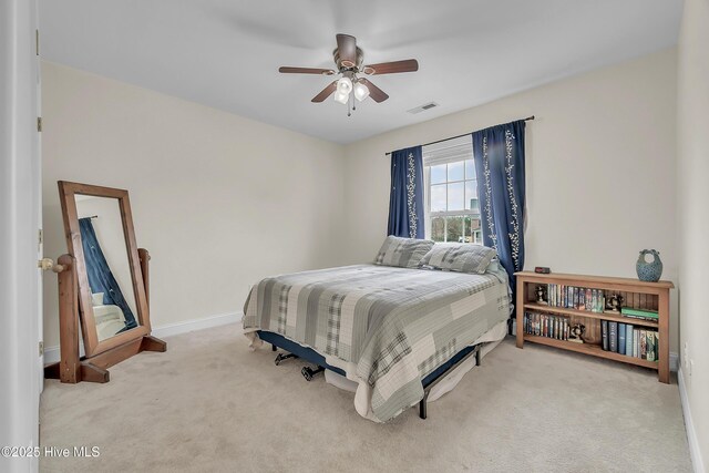 232 E Ivybridge Dr, Hubert, NC 28539 - bedroom with carpet floors, a ceiling fan, and baseboards