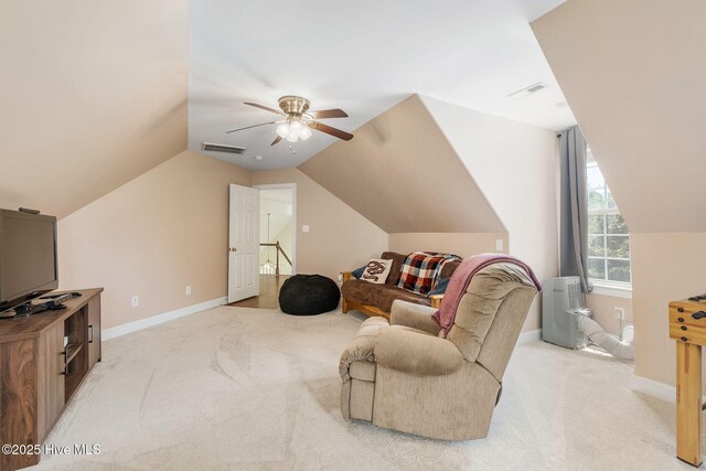 232 E Ivybridge Dr, Hubert, NC 28539 - living area with light colored carpet, ceiling fan, vaulted ceiling, baseboards, and an upstairs landing