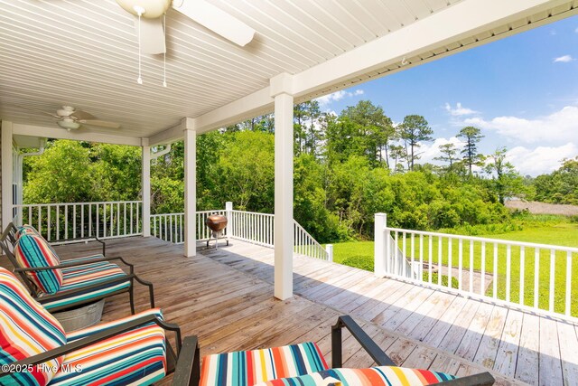 232 E Ivybridge Dr, Hubert, NC 28539 - wooden deck with ceiling fan, a lawn, and view of wooded area