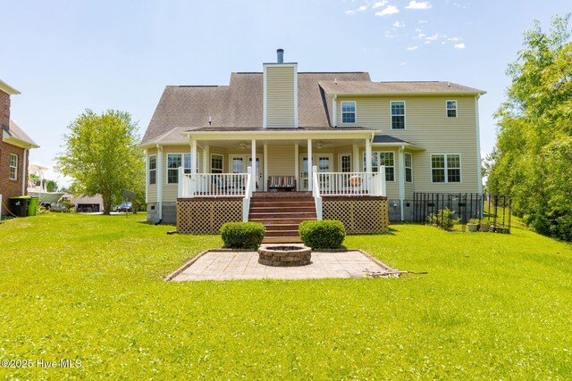 232 E Ivybridge Dr, Hubert, NC 28539 - rear view of house featuring a patio, stairs, a chimney, crawl space, and a fire pit