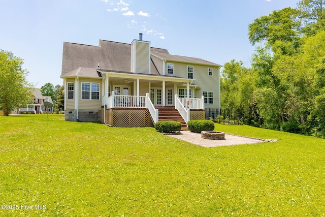 232 E Ivybridge Dr, Hubert, NC 28539 - back of house featuring a fire pit, stairway, a yard, crawl space, and a chimney