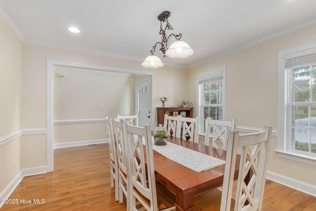 232 E Ivybridge Dr, Hubert, NC 28539 - dining area with light wood-style floors, ornamental molding, healthy amount of natural light, and baseboards