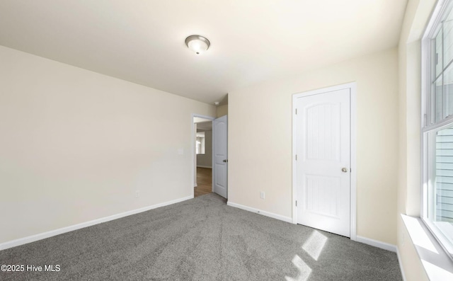 unfurnished bedroom with carpet floors