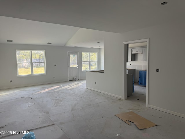 unfurnished living room with visible vents