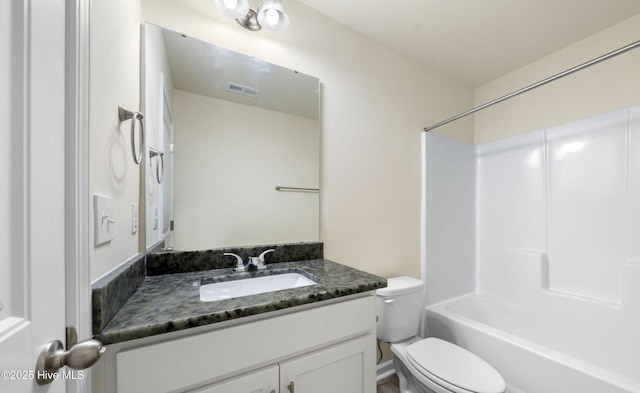 bathroom with toilet, vanity, shower / bathing tub combination, and visible vents
