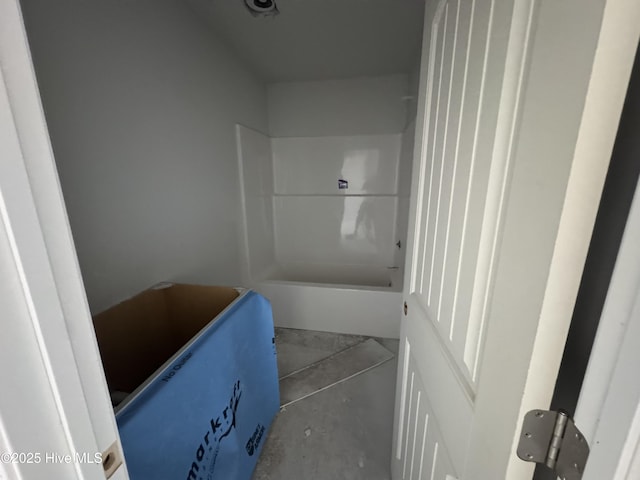 bathroom with concrete flooring