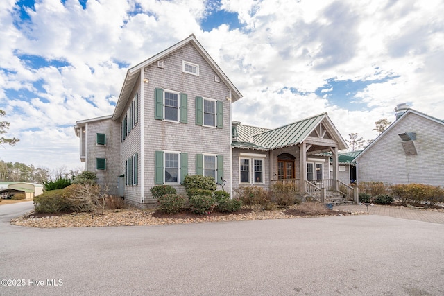 view of front of home featuring a standing seam roof and metal roof