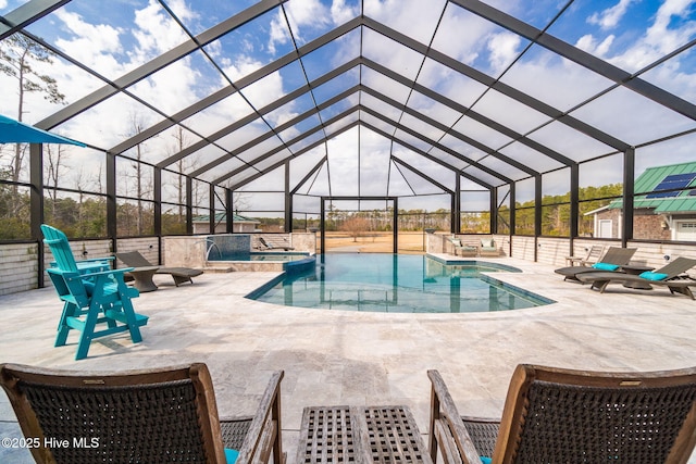 outdoor pool featuring a lanai, a patio, and an outdoor hot tub