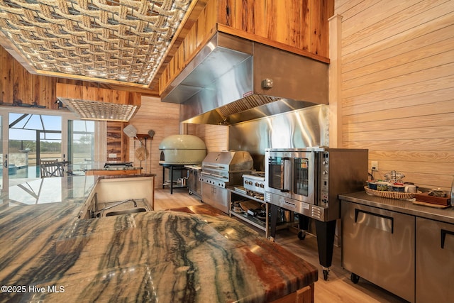 811 Hwy 70 Davis, Davis, NC 28524 - kitchen featuring wooden walls and light wood-type flooring