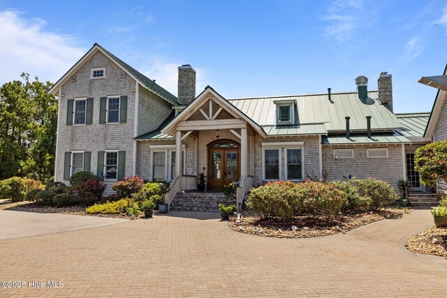 811 Hwy 70 Davis, Davis, NC 28524 - view of front facade featuring a chimney, a standing seam roof, french doors, and a metal roof