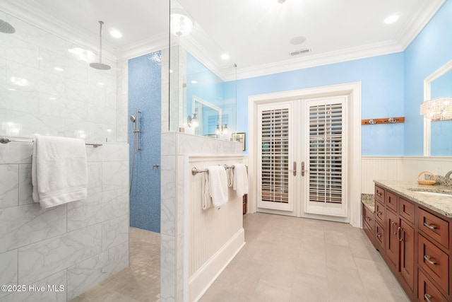 bathroom with walk in shower, french doors, visible vents, and ornamental molding