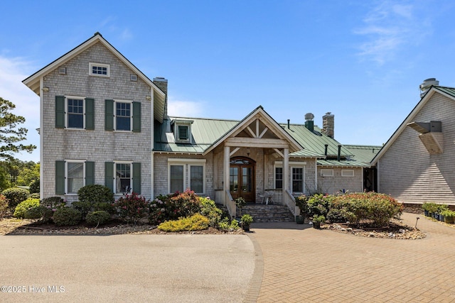 811 Hwy 70 Davis, Davis, NC 28524 - view of front of home with a chimney, a metal roof, french doors, and a standing seam roof