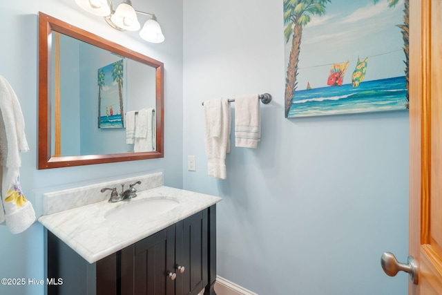 bathroom featuring baseboards and vanity