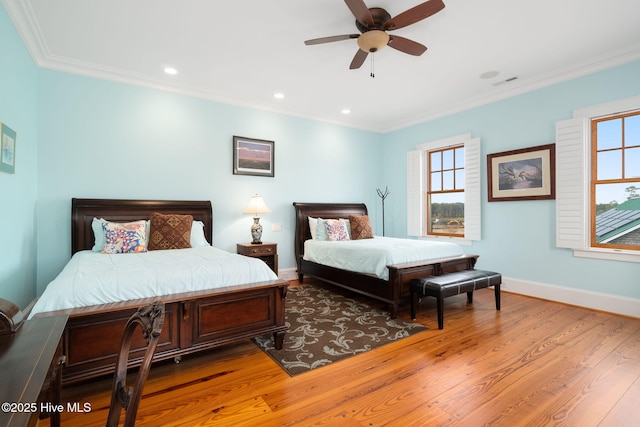 bedroom with ornamental molding, a ceiling fan, wood finished floors, recessed lighting, and baseboards