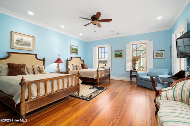 bedroom with crown molding, recessed lighting, baseboards, and wood-type flooring