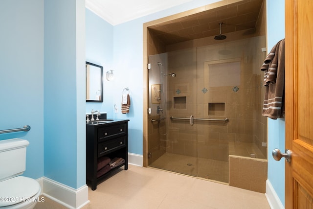 full bathroom with baseboards, tiled shower, toilet, and vanity