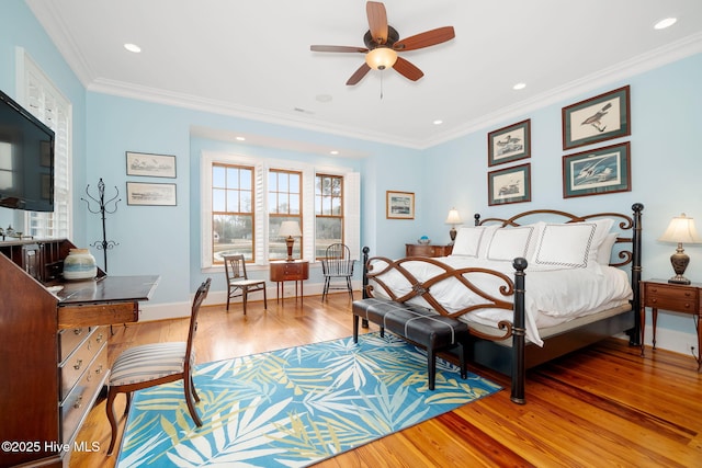 bedroom featuring light wood finished floors, recessed lighting, crown molding, and baseboards