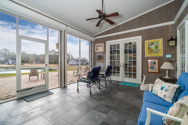 sunroom featuring a ceiling fan, lofted ceiling, french doors, and wooden ceiling