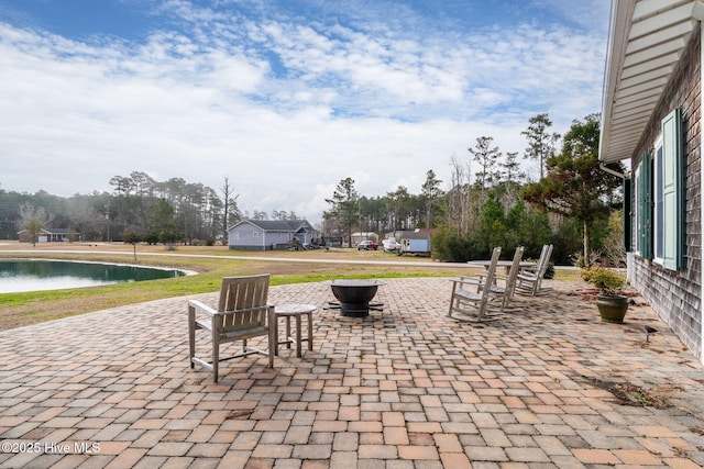 view of patio / terrace featuring a water view