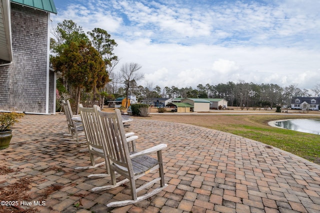 view of patio featuring a water view