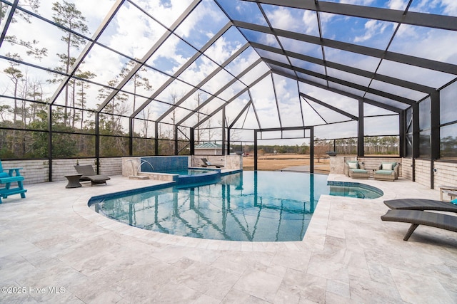 view of swimming pool with glass enclosure, an outdoor living space, a patio area, and a pool with connected hot tub