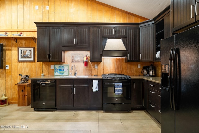 kitchen featuring black appliances, a sink, light countertops, custom exhaust hood, and vaulted ceiling