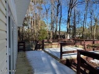 view of snow covered deck