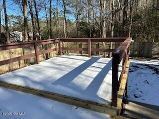 view of snow covered deck