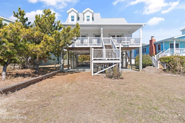 view of front of home featuring a carport and covered porch