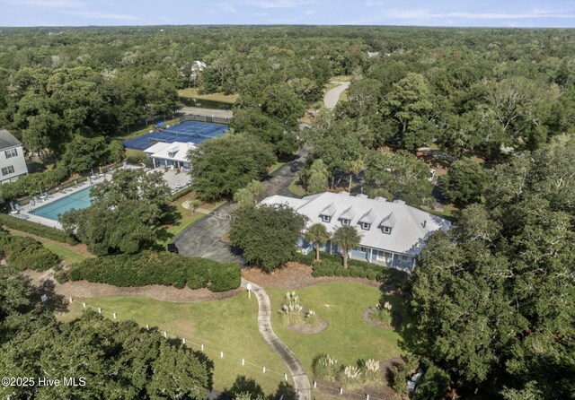 cape cod home with a front lawn