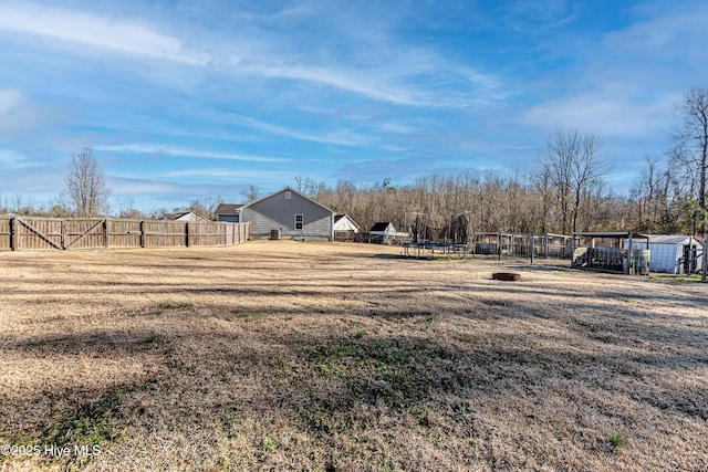 view of yard with a trampoline