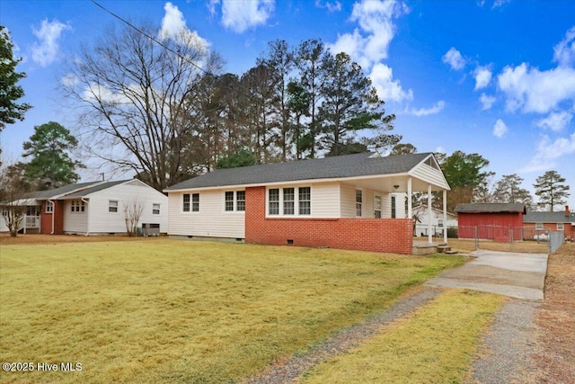 ranch-style home featuring central AC unit and a front yard