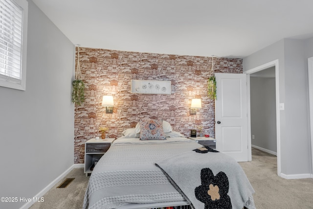 bedroom featuring light colored carpet