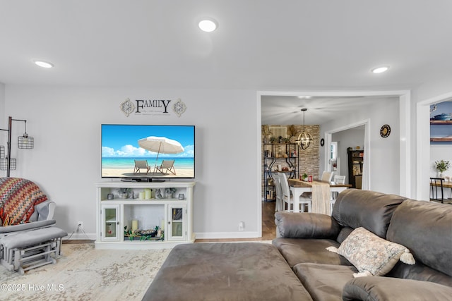 living room with a notable chandelier