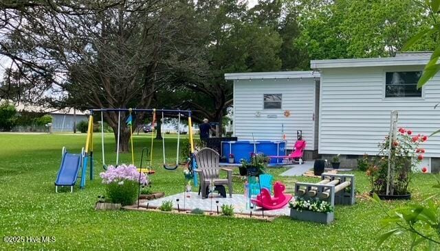 view of playground featuring a yard