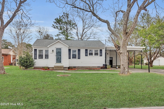 ranch-style house with a carport and a front lawn