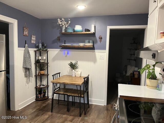 dining area featuring dark hardwood / wood-style floors