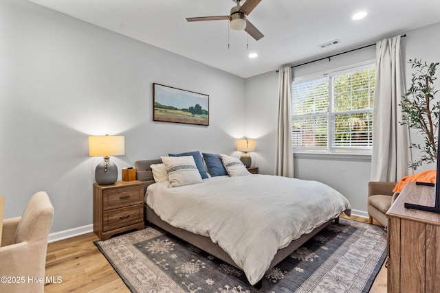 bedroom featuring ceiling fan and light hardwood / wood-style flooring