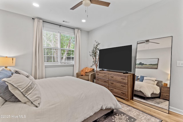 bedroom featuring wood-type flooring and ceiling fan