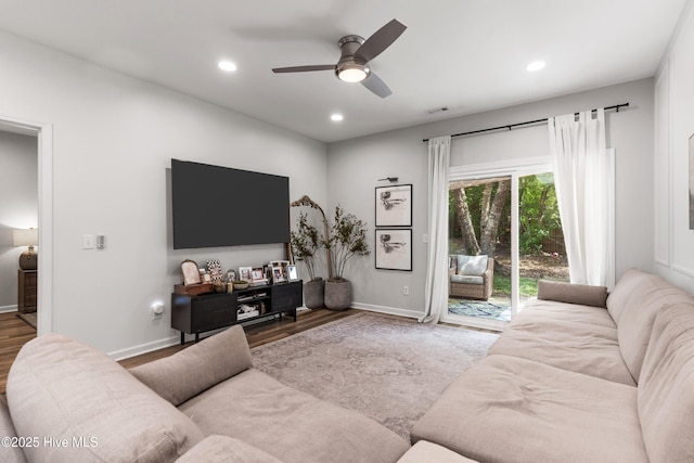 living room with ceiling fan and hardwood / wood-style floors