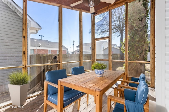 sunroom with a ceiling fan