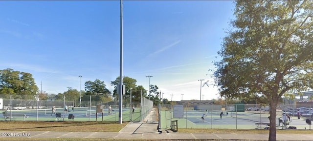 view of sport court with fence