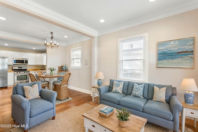 living room featuring baseboards, light wood-style flooring, recessed lighting, crown molding, and a notable chandelier