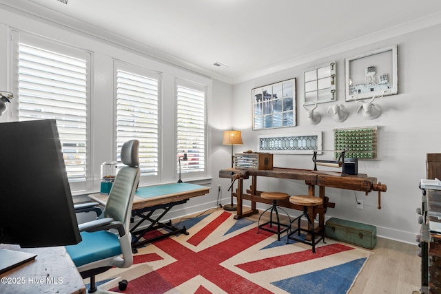 office with hardwood / wood-style flooring and crown molding