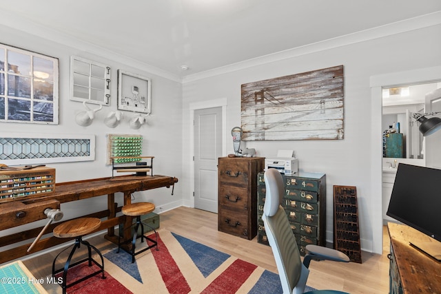 office space featuring ornamental molding and light wood-type flooring